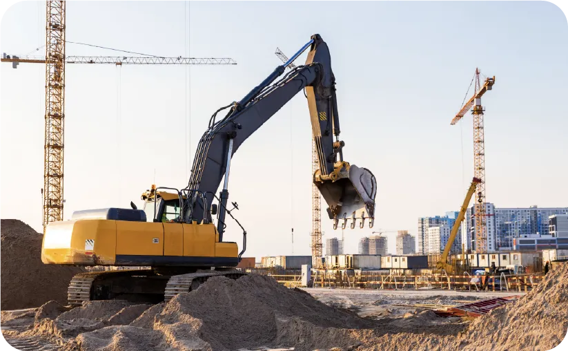 Un chantier avec une pelleteuse qui creuse